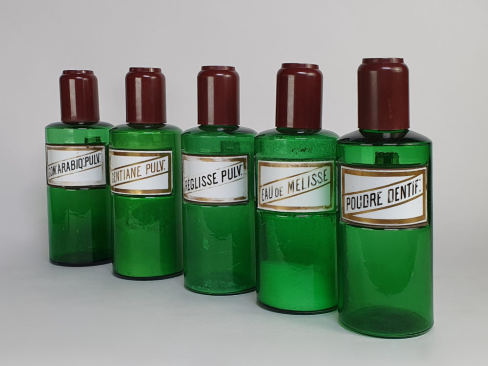 Decorative antique green French Pharmacy Bottles with porcelain labels