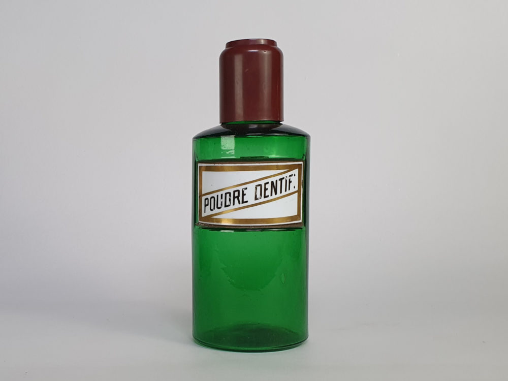 Decorative antique green French Pharmacy Bottles with porcelain labels