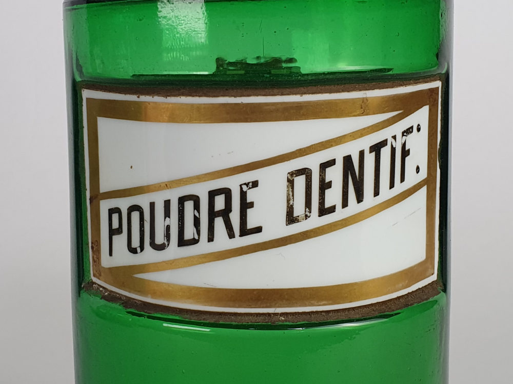 Decorative antique green French Pharmacy Bottles with porcelain labels