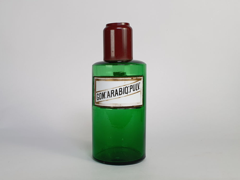 Decorative antique green French Pharmacy Bottles with porcelain labels