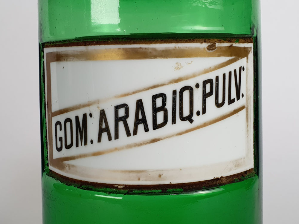 Decorative antique green French Pharmacy Bottles with porcelain labels