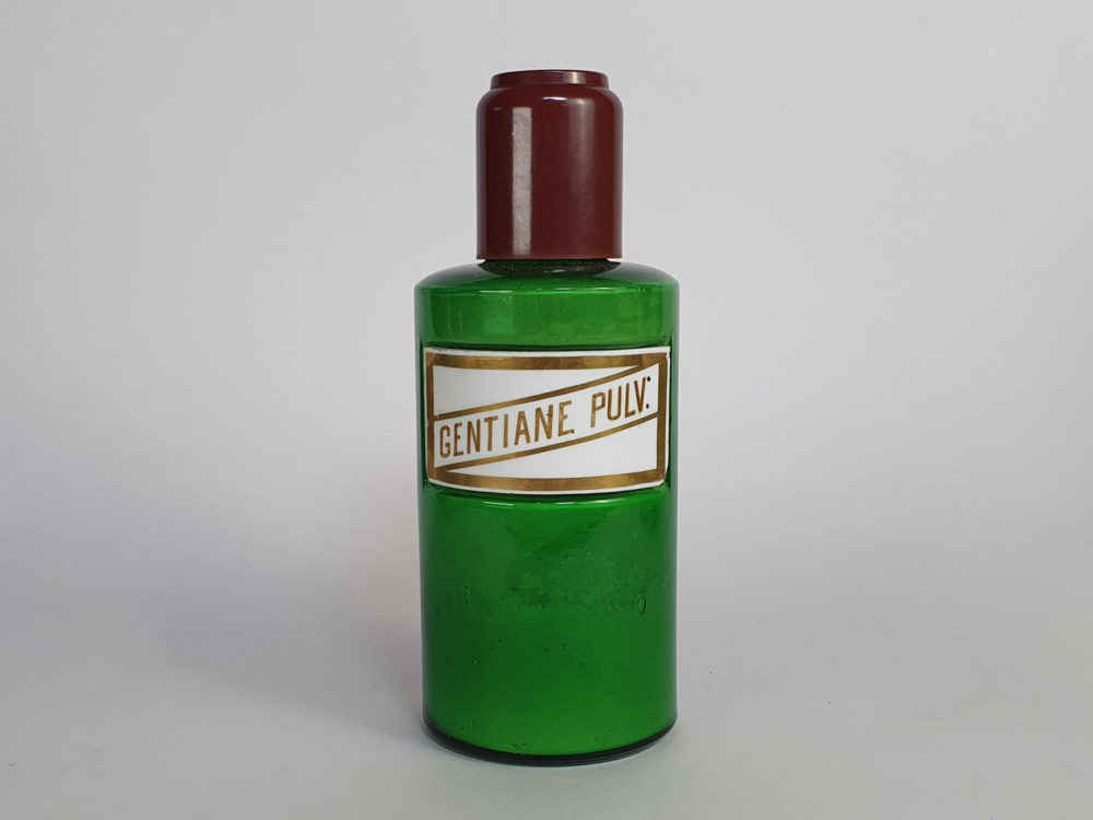 Decorative antique green French Pharmacy Bottles with porcelain labels