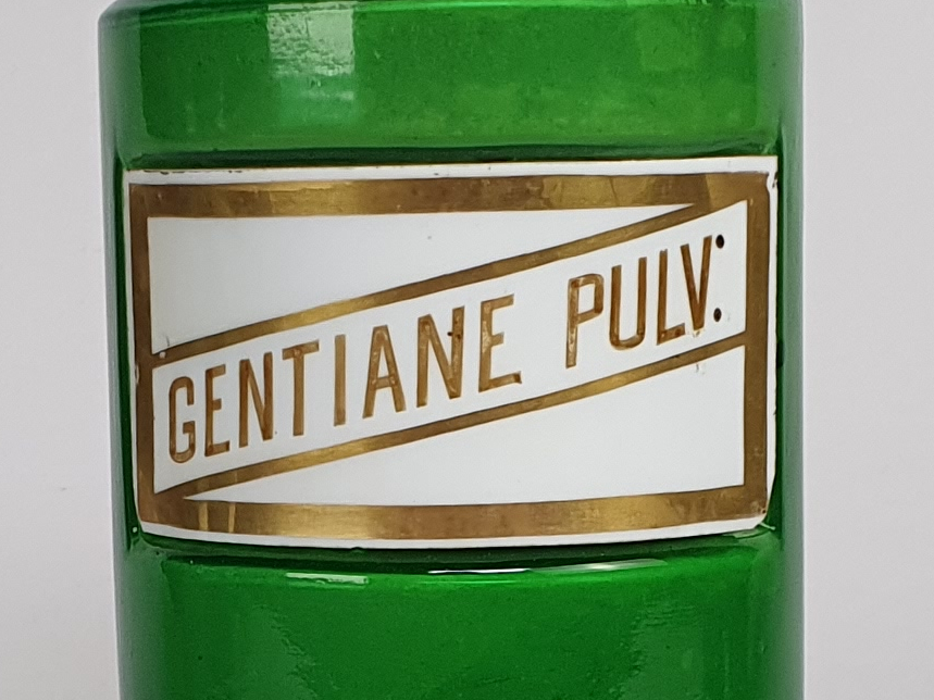 Decorative antique green French Pharmacy Bottles with porcelain labels
