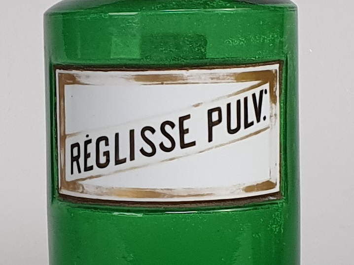 Decorative antique green French Pharmacy Bottles with porcelain labels