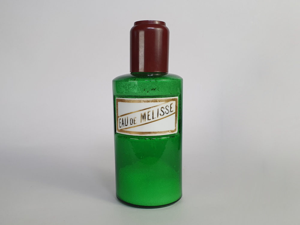 Decorative antique green French Pharmacy Bottles with porcelain labels