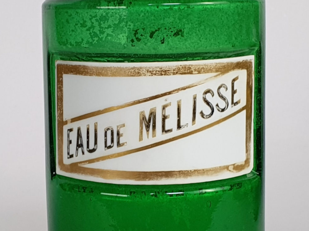 Decorative antique green French Pharmacy Bottles with porcelain labels