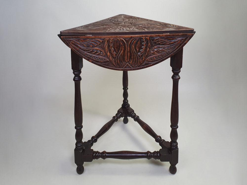 Early 1900s antique oak carved Cricket Table with drop leaf sides
