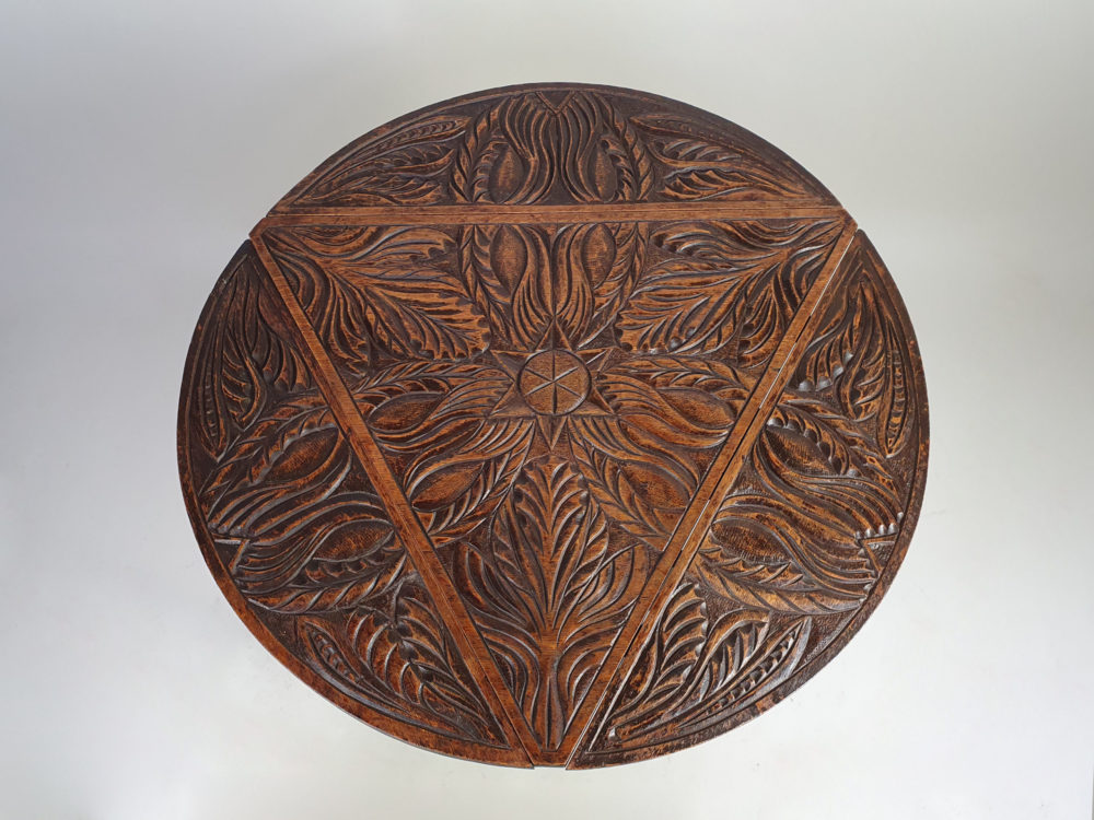 Early 1900s antique oak carved Cricket Table with drop leaf sides