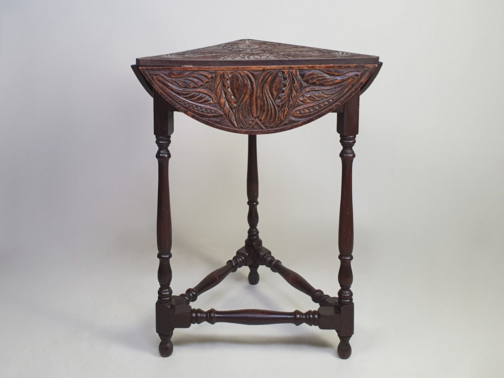 Early 1900s antique oak carved Cricket Table with drop leaf sides
