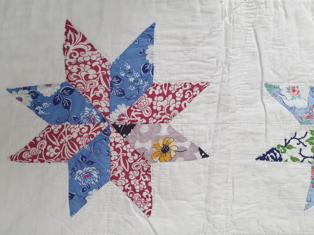 Handstitched patchwork antique Quilt with floral star designs