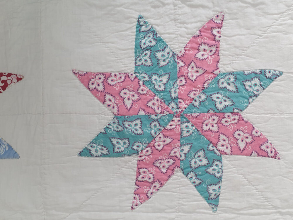 Handstitched patchwork antique Quilt with floral star designs