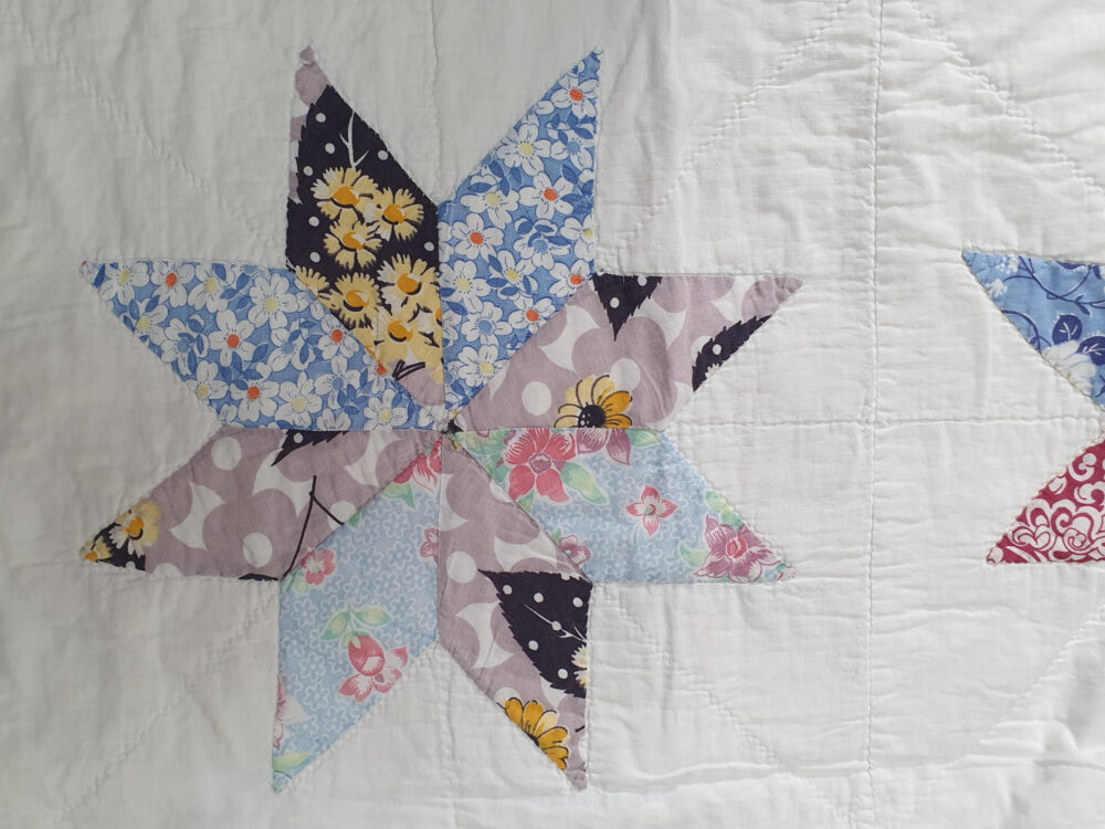 Handstitched patchwork antique Quilt with floral star designs