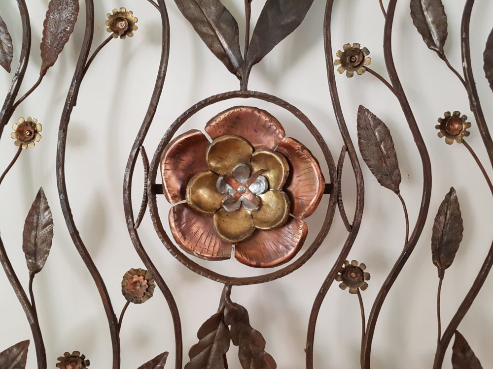 Mid century antique wrought iron sculpture with a copper Flower