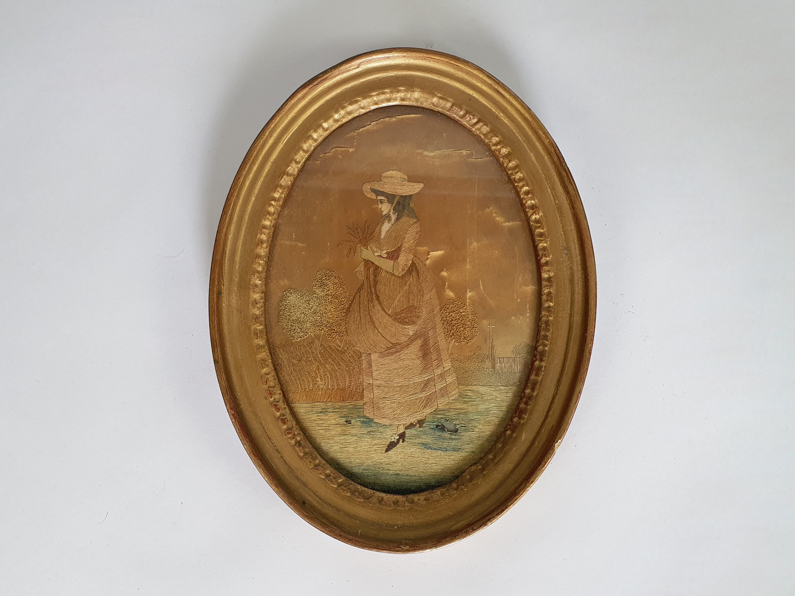 Pair of 19th century antique Georgian Silk Work Ladies in oval frames