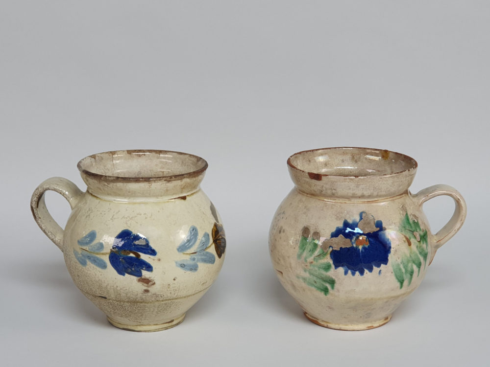 Pair of 19th century rustic floral pottery Jugs
