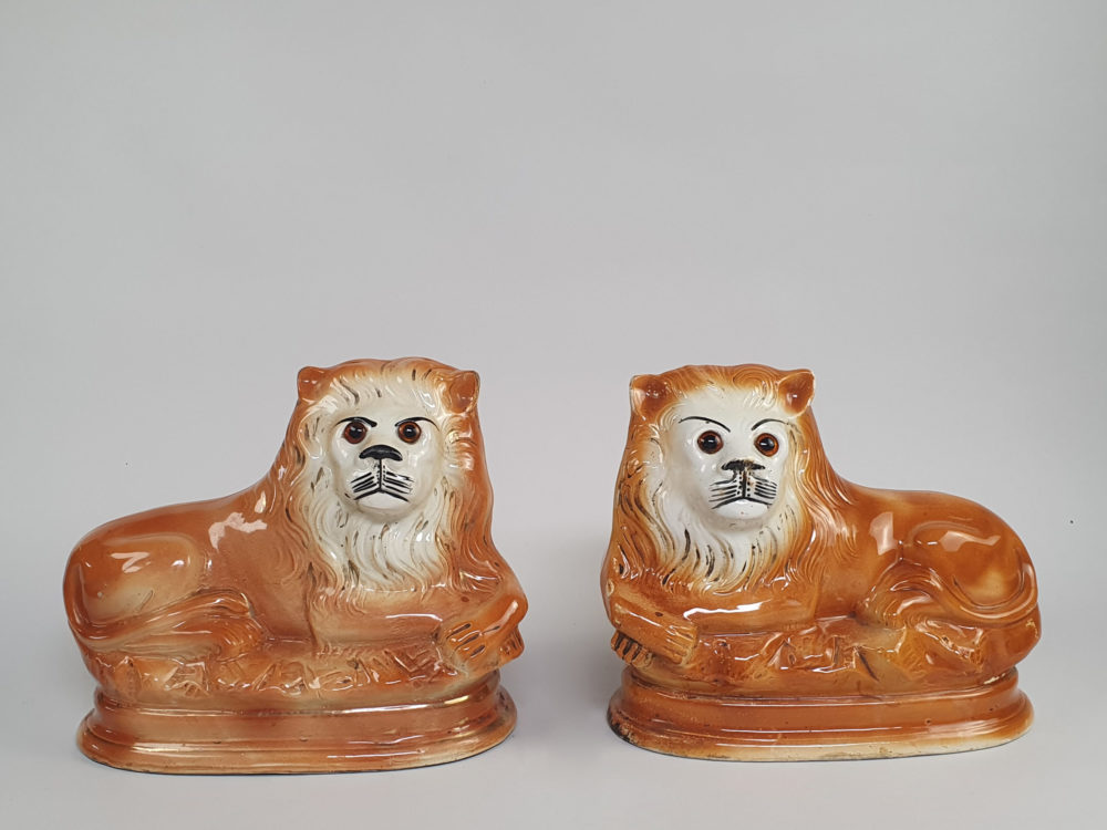 Pair of antique Victorian Bo'ness Staffordshire style hand painted pottery Lions