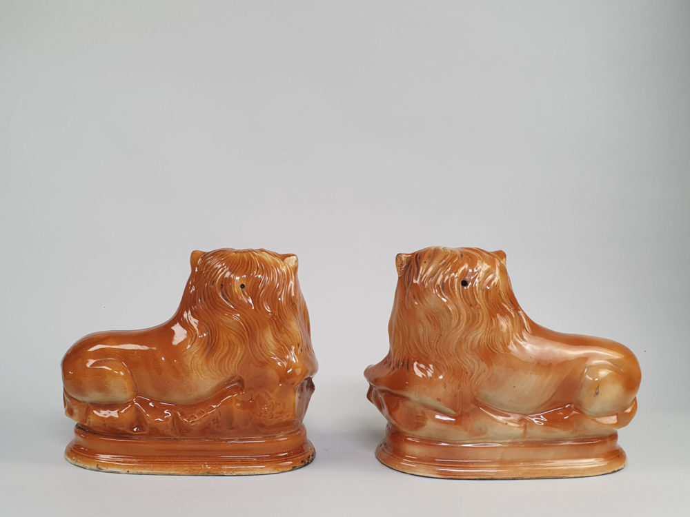 Pair of antique Victorian Bo'ness Staffordshire style hand painted pottery Lions
