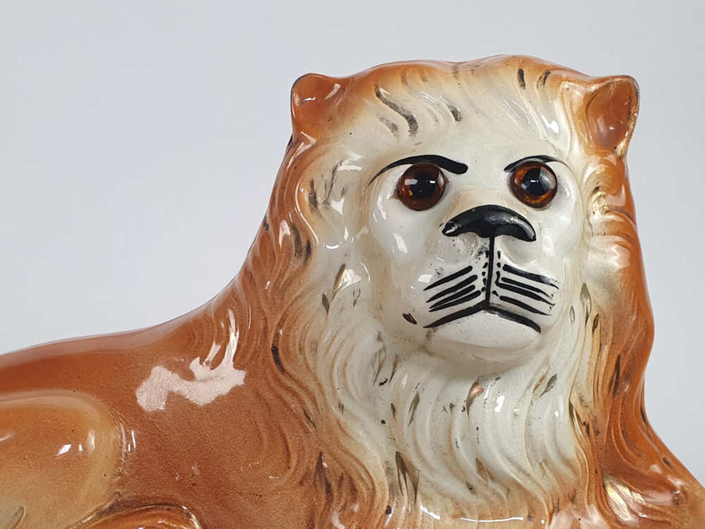 Pair of antique Victorian Bo'ness Staffordshire style hand painted pottery Lions
