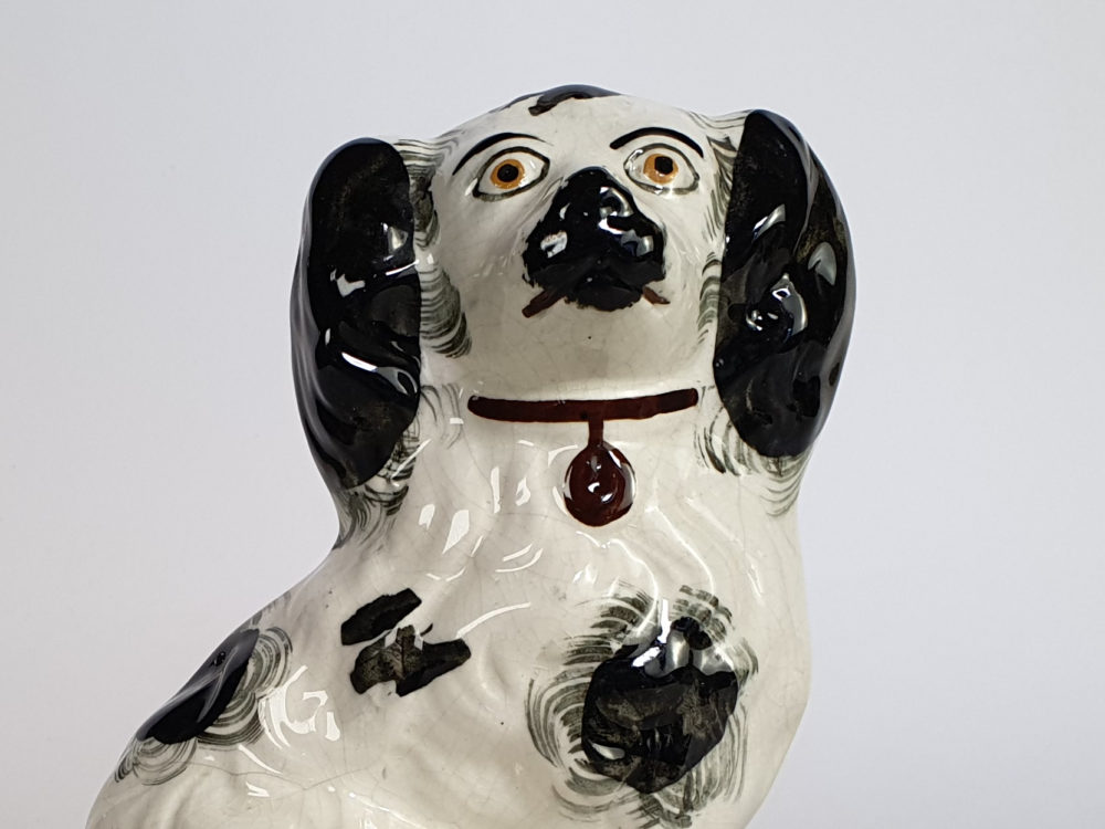 A pair of antique Victorian Staffordshire pottery Spaniel Dogs