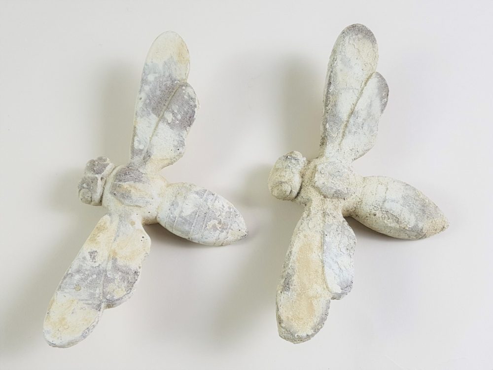 Pair of antique stone Bees from a Church building