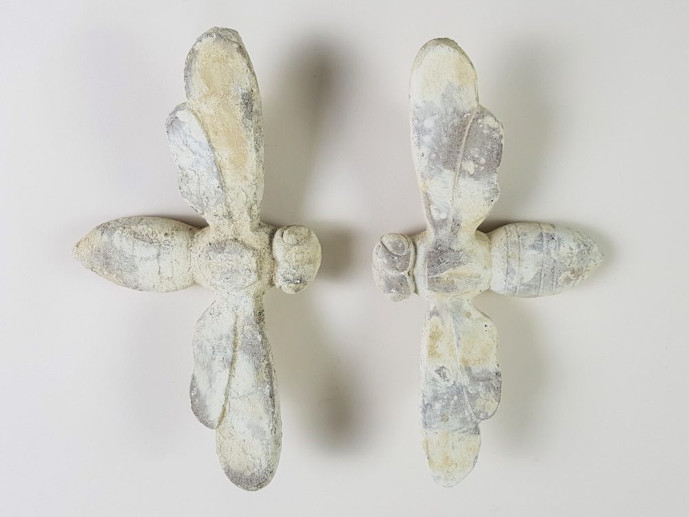 Pair of antique stone Bees from a Church building