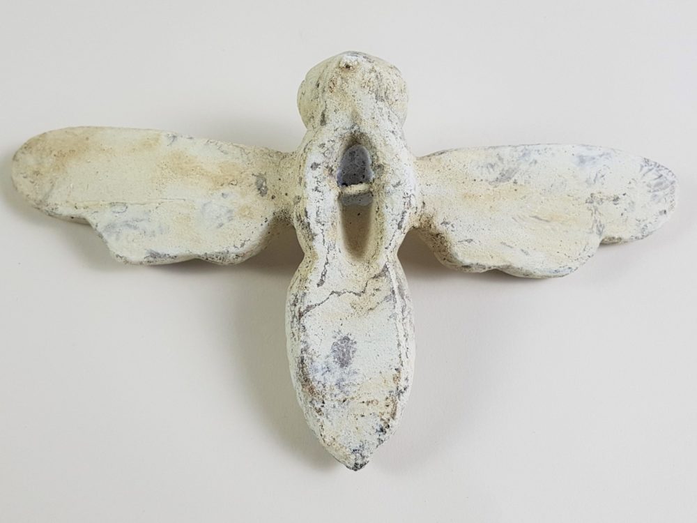 Pair of antique stone Bees from a Church building