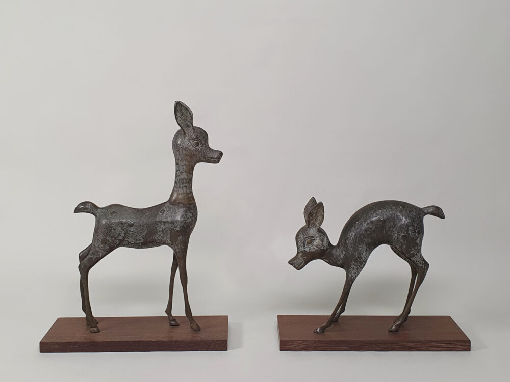 Pair of mid century decorative antique Deer and Fawn Statutes, on wenge plinths