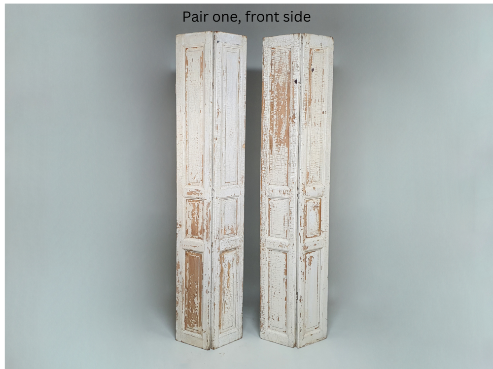 Two pairs of tall panelled antique Shutters in original cream paint