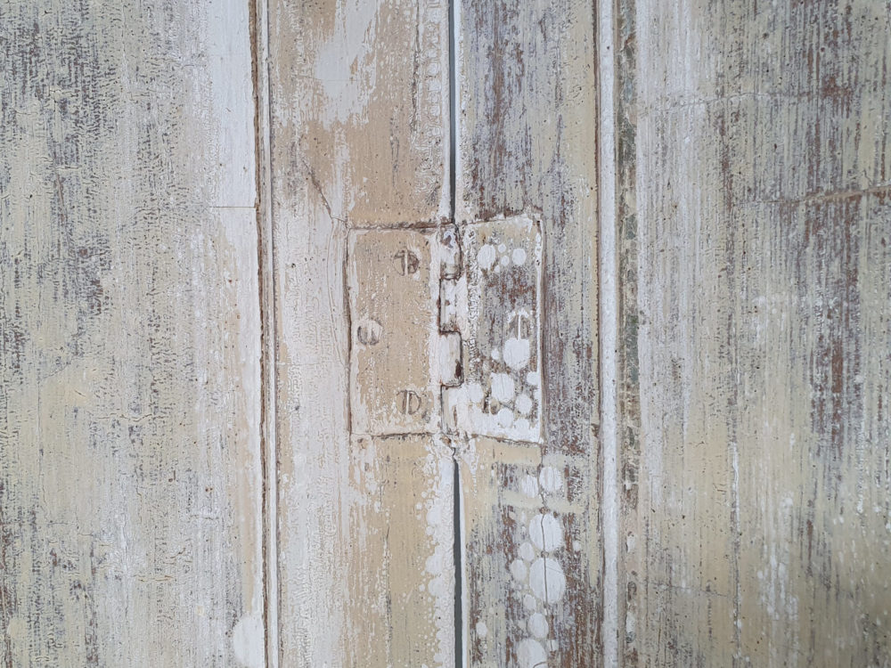 Two pairs of tall panelled antique Shutters in original cream paint