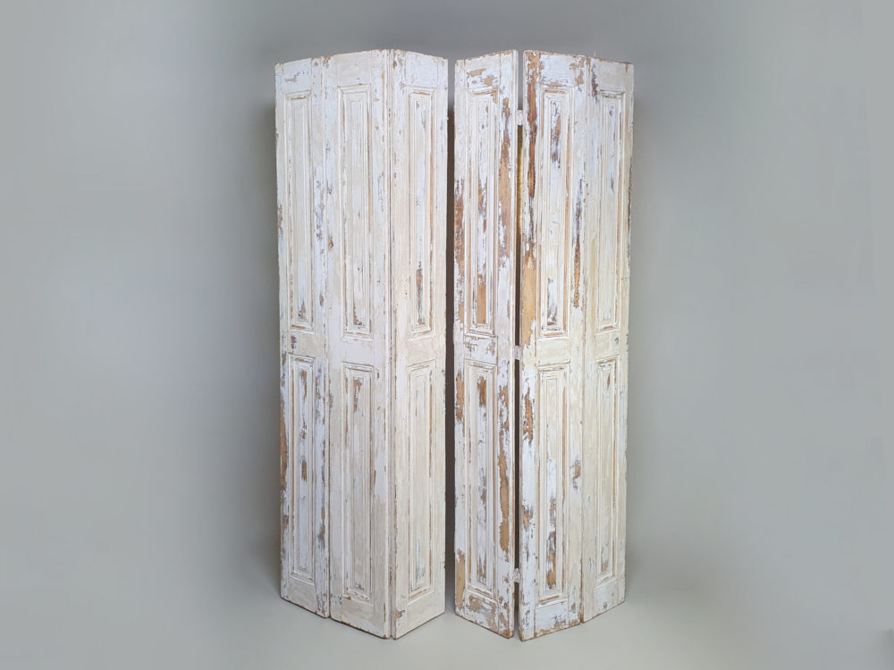 Pair of antique panelled Shutters in original cream paint