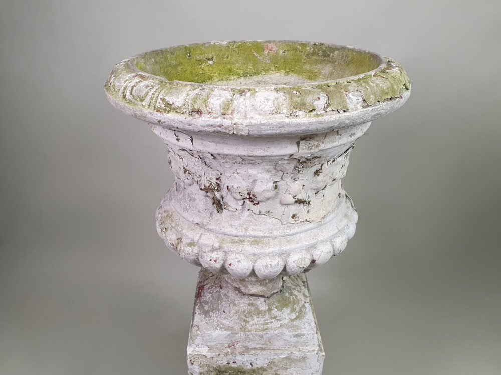 Pair of tall well weathered antique Garden Urns on Plinths