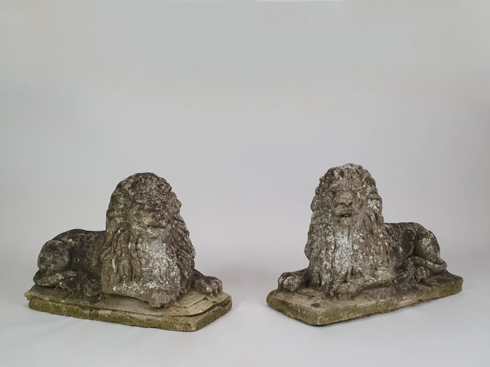 Pair of well worn antique garden Lions