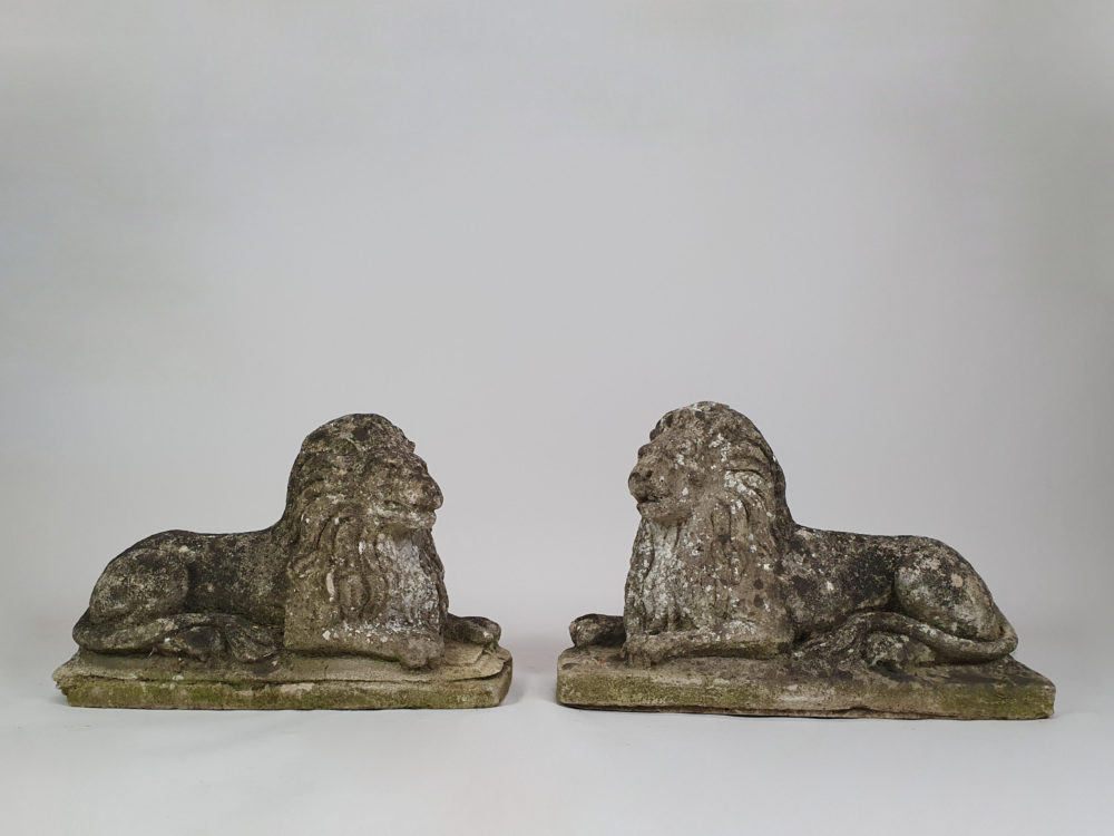 Pair of well worn antique garden Lions