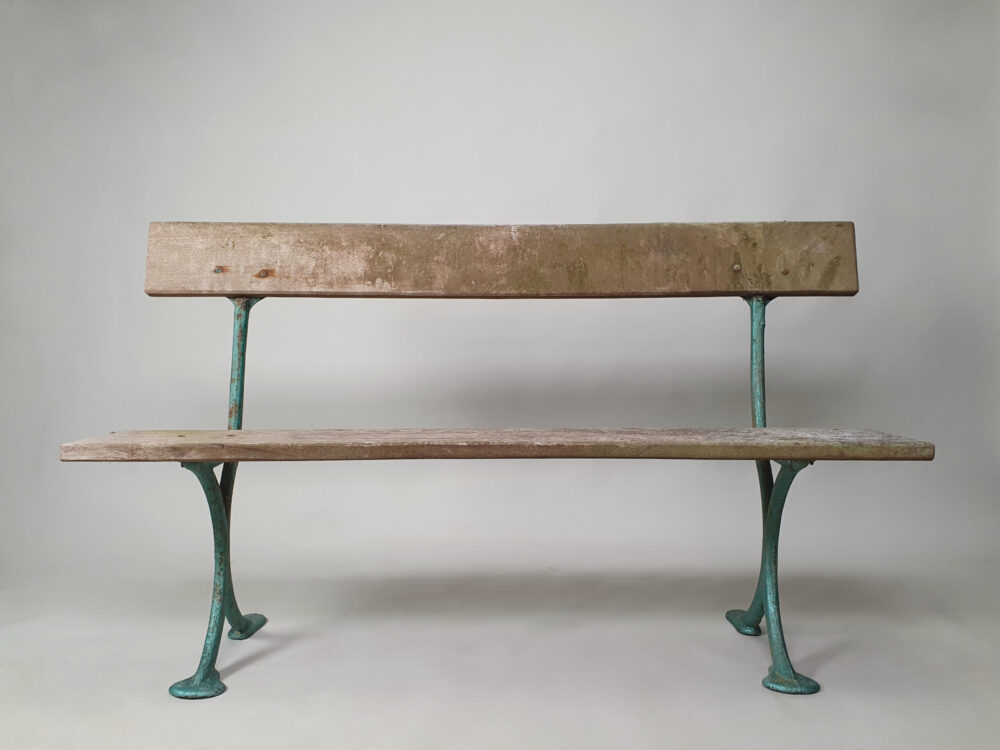 Rustic antique simple cast iron Garden Bench with wooden planks and old green paint