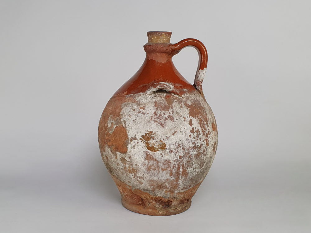 Rustic antique terracotta pottery Amphora with a worn russet glaze