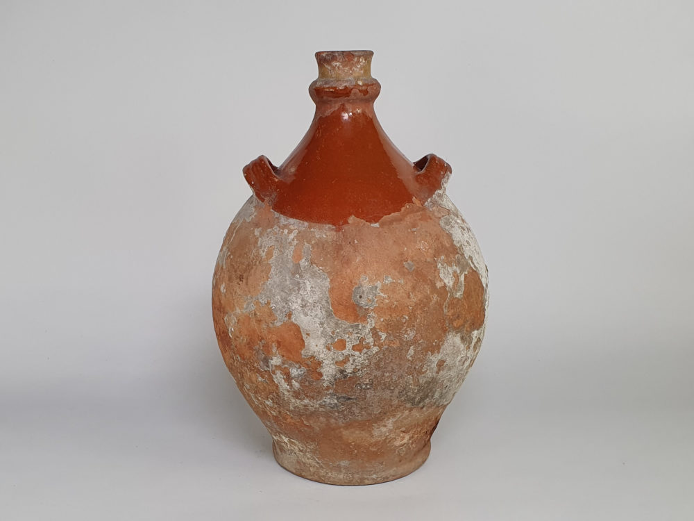 Rustic antique terracotta pottery Amphora with a worn russet glaze