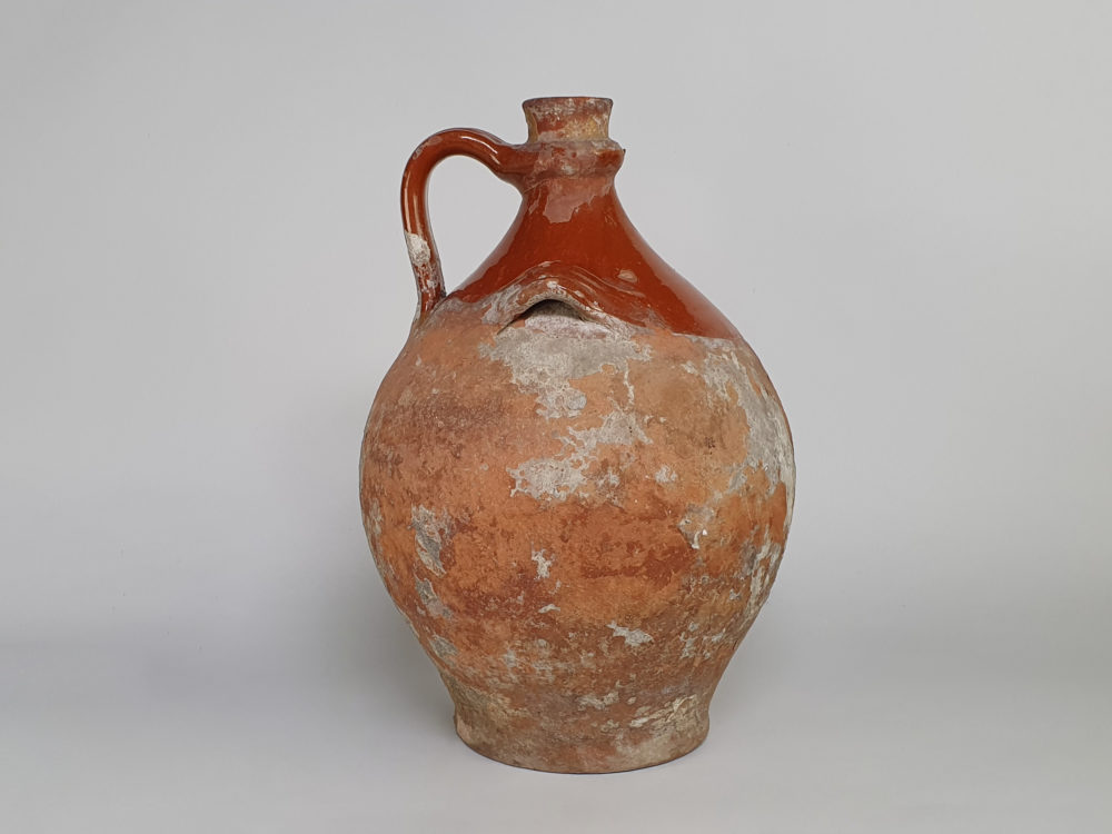Rustic antique terracotta pottery Amphora with a worn russet glaze