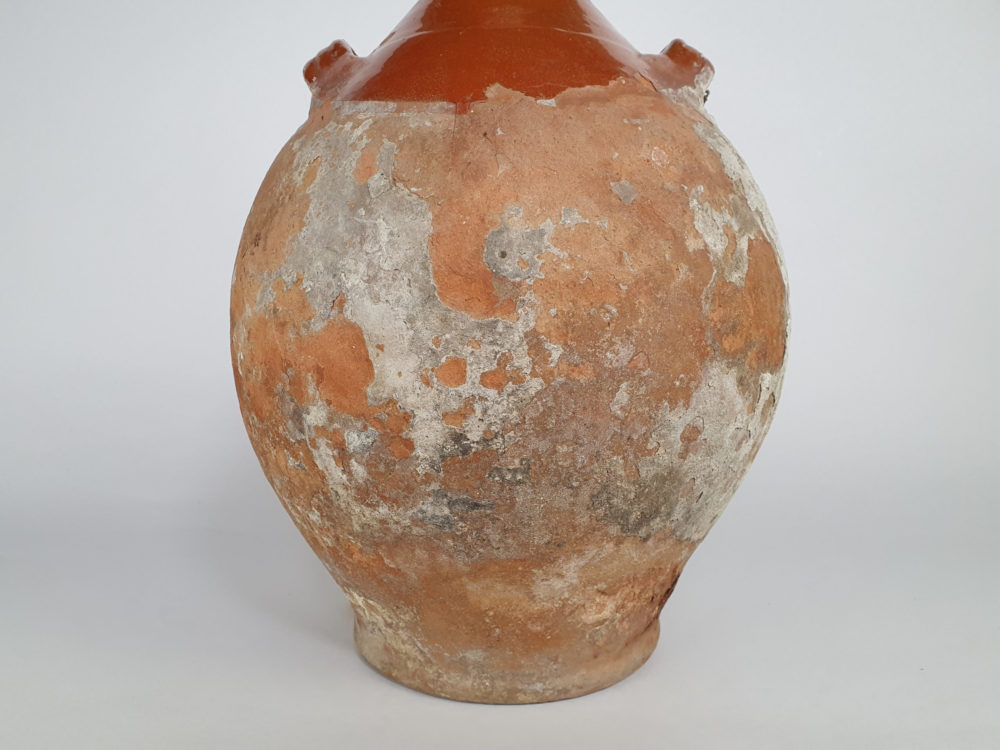 Rustic antique terracotta pottery Amphora with a worn russet glaze