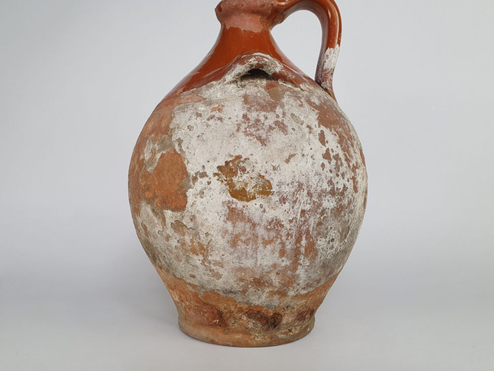 Rustic antique terracotta pottery Amphora with a worn russet glaze