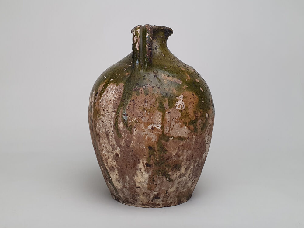 Rustic pottery French Olive Jar or Amphora with a worn green glaze
