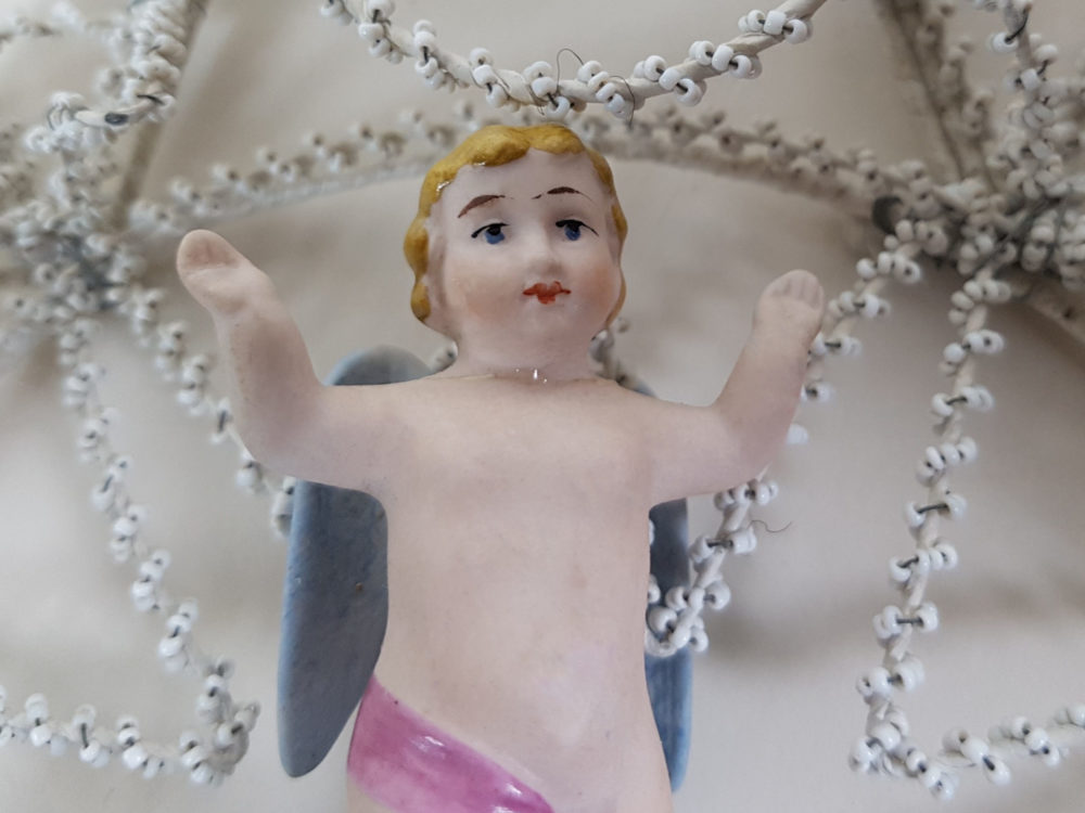 Star shaped antique Bead Work Wreath with Cherub