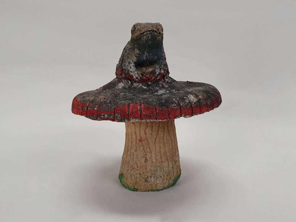 Toad sitting on toadstool - antique garden Ornament
