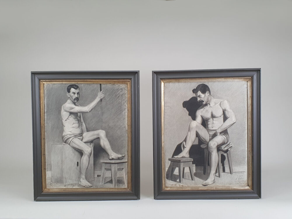 Two antique French academic charcoal life drawings of nude male figures