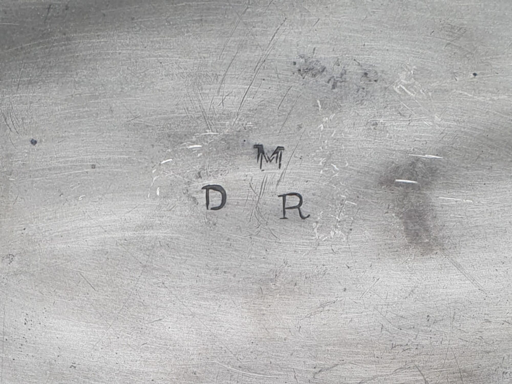 A large antique Georgian 18th century pewter Charger with and beaten detailing