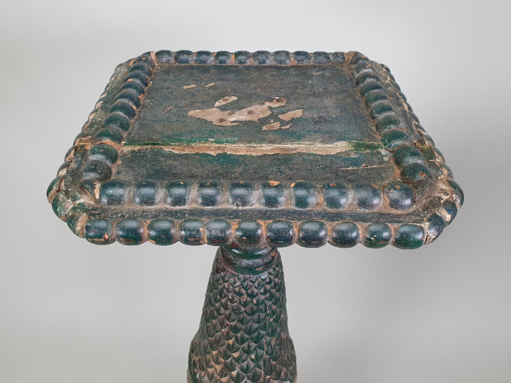A pair of decorative antique Torchères in original green paint