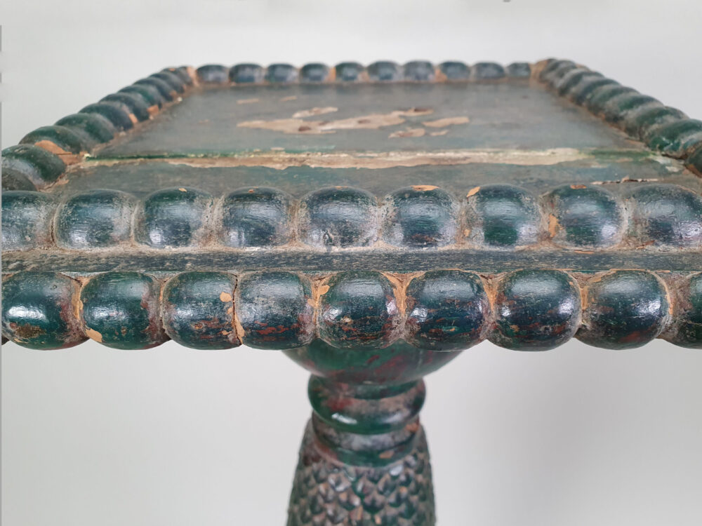 A pair of decorative antique Torchères in original green paint