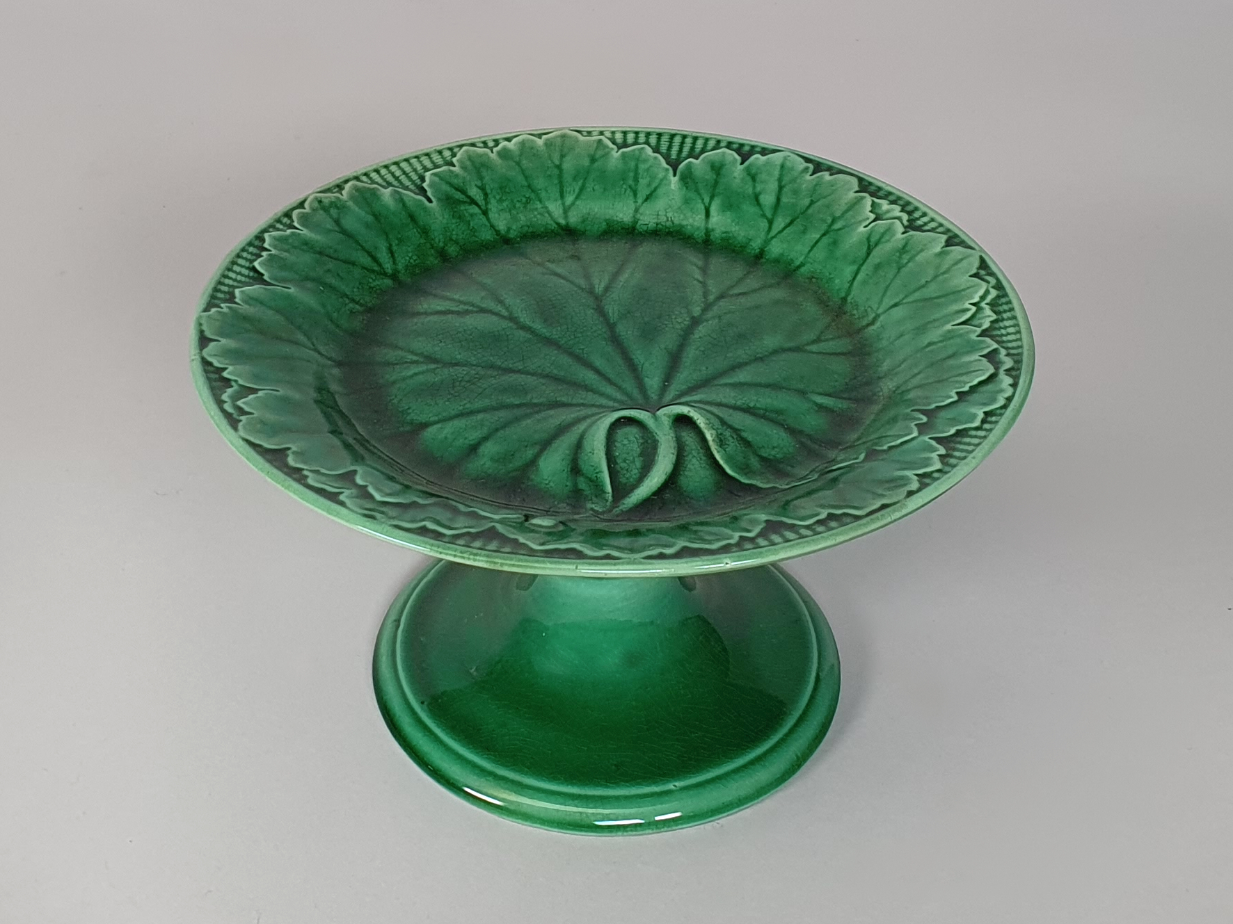A Victorian antique ceramic majolica green Cabbage Leaf Cake  Dessert Stand or Pedestal Compote, by Wedgwood 