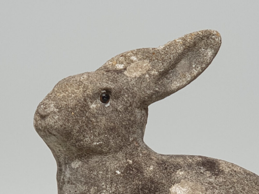 A well weathered Rabbit antique garden ornament