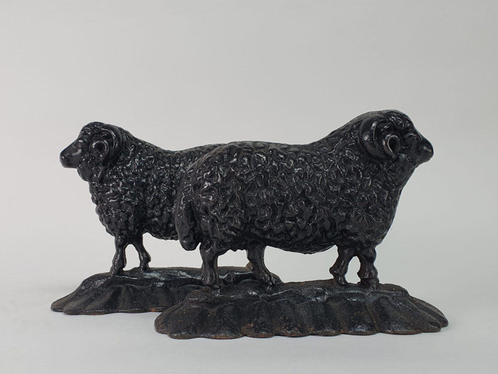 Antique cast iron matched pair of male and female Black Sheep