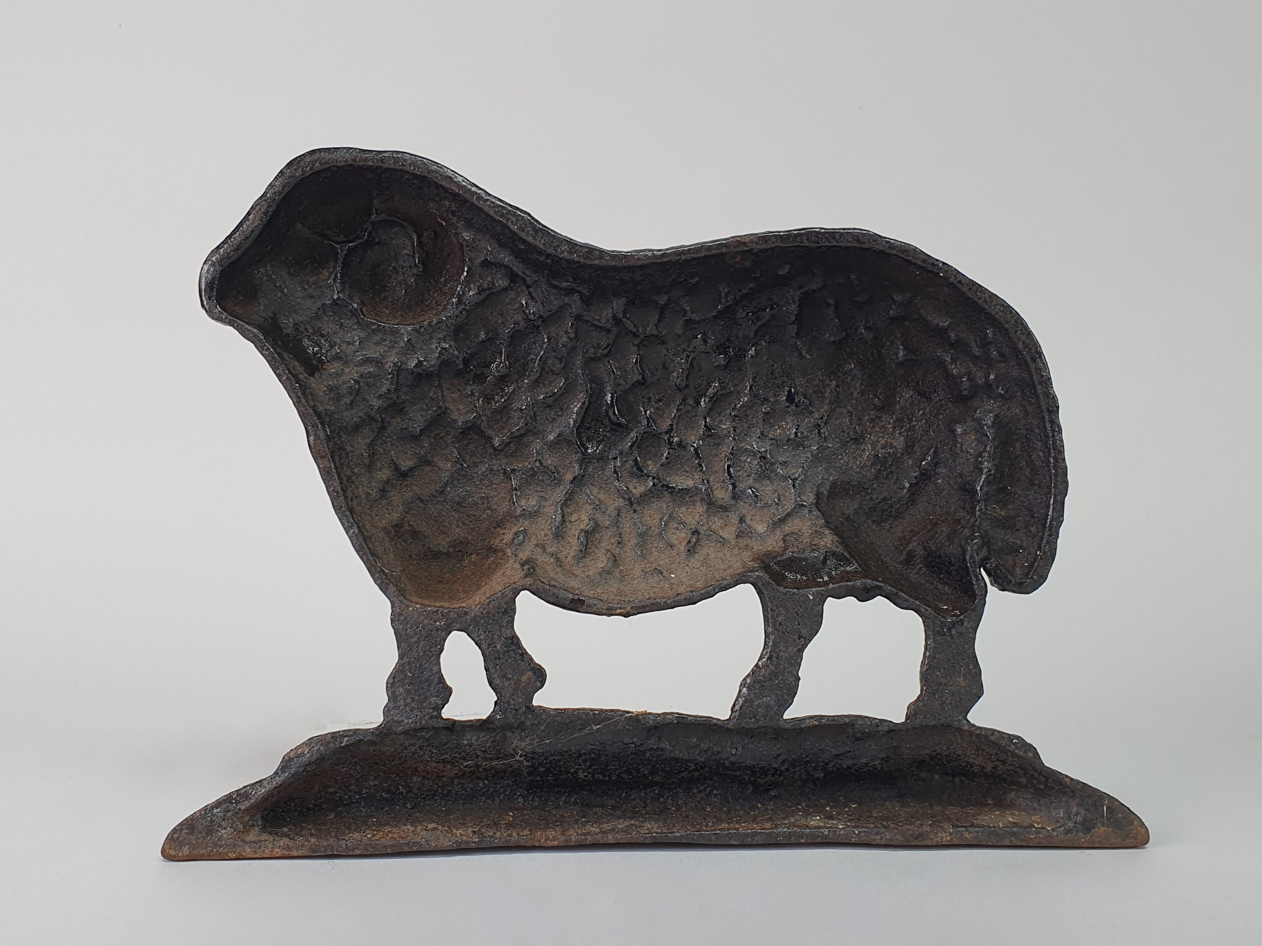 Antique cast iron matched pair of male and female Black Sheep